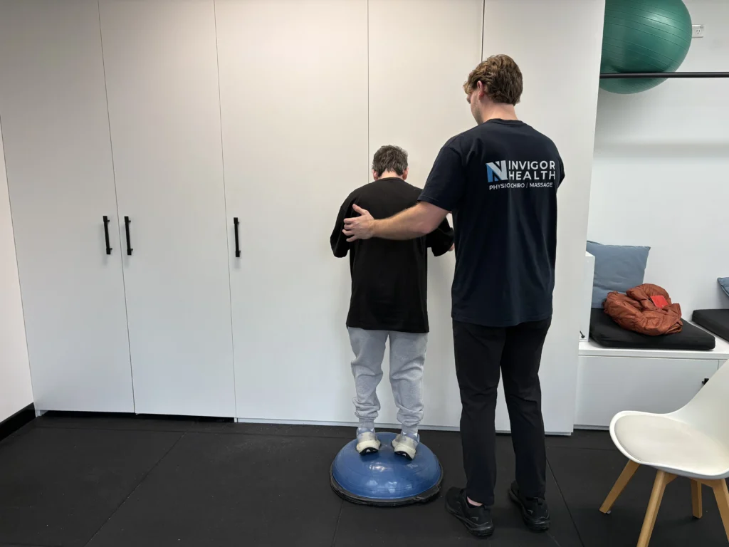 Patient completing rehabilitation exercises with a physiotherapist